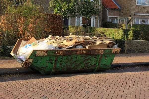 loaded dumpster in home renovations site